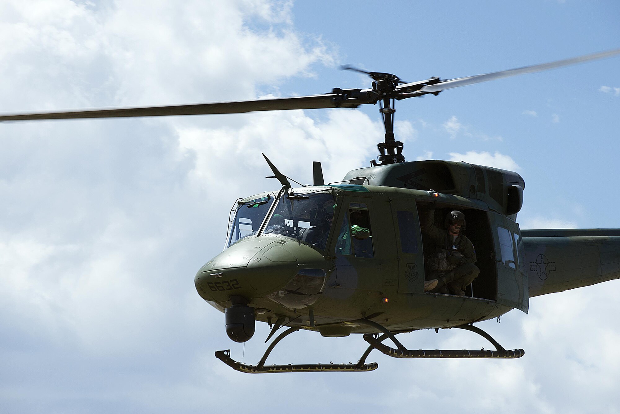 A UH-1N Huey from the 582nd Helicopter Group ascends during a training exercise Aug. 10, 2015. The helicopter crews from the 582nd HG provide air support and transport for security forces members in the missile complex. (U.S. Air Force file photo by Senior Airman Brandon Valle)