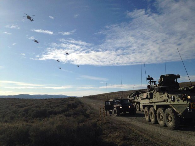 Soldiers from 1st Battalion, 23rd Infantry Regiment, 1-2 Stryker Brigade Combat Team, conduct a simultaneous ground and air assault from Joint Base Lewis-McChord into Yakima Training Center in late February 2016. (Photo courtesy of U.S. Army/Released)