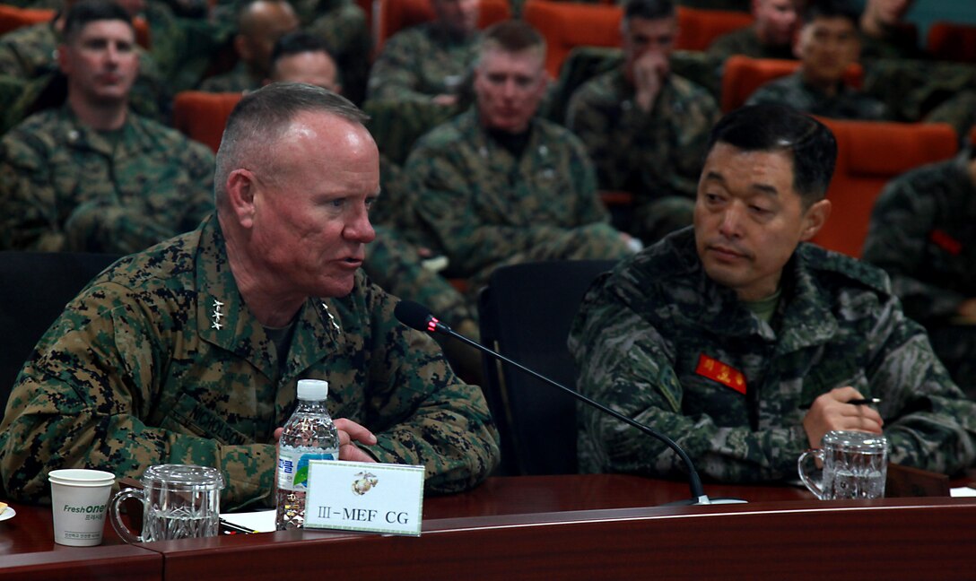 Lt. Gen. Lawrence D. Nicholson (left), III Marine Expeditionary Force Commanding General, discusses increased partnership and training with Maj. Gen. Chang Ryong Choi, Republic of Korea 1st Marine Division Commanding General, Feb. 24, 2016, in Pohang, South Korea. More than 60 Marines and sailors with III MEF, III MEF subordinate commands and adjacent commands based in Japan and South Korea, met in the South in order to uphold and strengthen the alliance between the ROK and the U.S., and reinforce their commitment to defend the country at a moment’s notice. The visit took place in various locations throughout the country, enhancing U.S. Marines' familiarization of the Korean Peninsula while simultaneously developing the kind of faith and trust between forces that can only be established through constant engagement, as well as rigorous and realistic training. Nicholson is a native of Toronto, Canada. (Official USMC photo by GySgt Jeremy Vought)