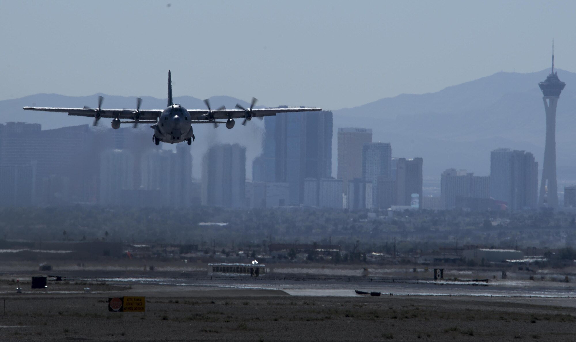 A C-130 assigned to the 700th Airlift Squadron, Dobbins Air Reserve Base, Georgia, takes off with the Las Vegas skyline as a backdrop on the first day of Red Flag 16-2 Feb. 29, 2016, at Nellis AFB, Nev. Red Flag was established in 1975 as one of the initiatives directed by General Robert J. Dixon, then commander of Tactical Air Command, to better prepare our forces for combat. (U.S. Air Force photo by Airman 1st Class Kevin Tanenbaum)