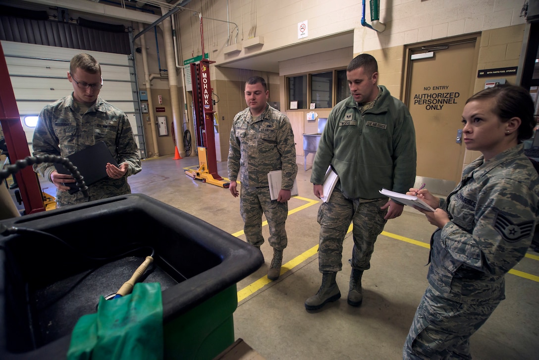 Airmen from the 137th Air Refueling Wing, Oklahoma City, and 190th Air Refueling Wing, Topeka, Kansas, check and discuss a washing station in the 137th Vehicle Maintenance Squadron at Will Rogers Air National Guard Base in Oklahoma City during a mock inspection, Feb. 25, 2016. The inspection was part of an Air National Guard-wide, four-day safety orientation course, which was mainly for unit safety representatives and supervisors, that focused on the importance of safety and mishap prevention. (U.S. Air National Guard photo by Senior Airman Kasey Phipps)