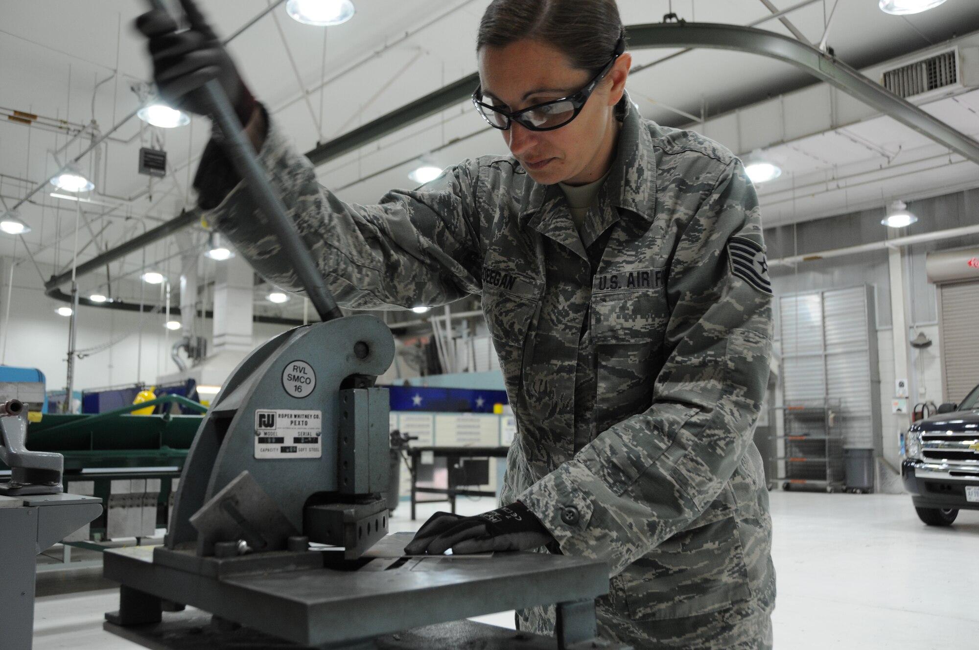Tech. Sgt. Billiesue Deegan, a sheet metal fabrication mechanic with the 161st Maintenance Group, utilizes a sheet metal corner notcher for an aircraft repair, Feb. 13, at Phoenix Sky Harbor Air National Guard Base. The metal shop performs aircraft sheet metal fabrication, structural repairs and modifications for aircraft. (U.S. Air National Guard photo by Tech. Sgt. Michael Matkin)