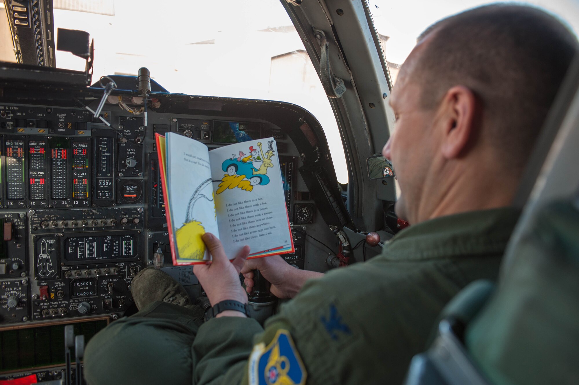 Col. Gentry Boswell, 28th Bomb Wing commander, reads a book in the flight deck of a B-1 bomber. Images were captured of Airmen reading around the base in recognition of National Read Across America Day, an observance in the United States celebrated on the school day closest to March 2, the birthday of Dr. Seuss. This day is a part of an overall Read Across America initiative, created by the National Education Association, dedicated to reading. (U.S. Air Force photo by 1st Lt. Rachel Allison/Released)