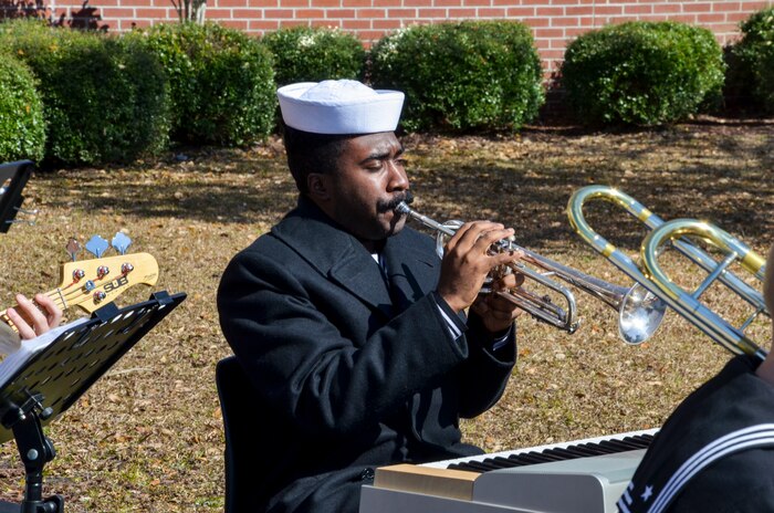 Sailors play music during the graduation ceremony of Nuclear Power School class 1506 at Naval Nuclear Power Training Command (NNPTC) in Goose Creek, S.C. Based at Joint Base Charleston-Naval Weapons Station, NNPTC trains Sailors in fundamentals of design, operation, and maintenance of shipboard nuclear propulsion plants. (U.S. Navy Photo by Mass Communication Specialist Second Class Corey Dill)