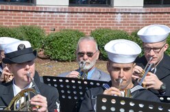 Sailors play music during the graduation ceremony of Nuclear Power School class 1506 at Naval Nuclear Power Training Command (NNPTC) in Goose Creek, S.C. Based at Joint Base Charleston-Naval Weapons Station, NNPTC trains Sailors in fundamentals of design, operation, and maintenance of shipboard nuclear propulsion plants. (U.S. Navy Photo by Mass Communication Specialist Second Class Corey Dill)