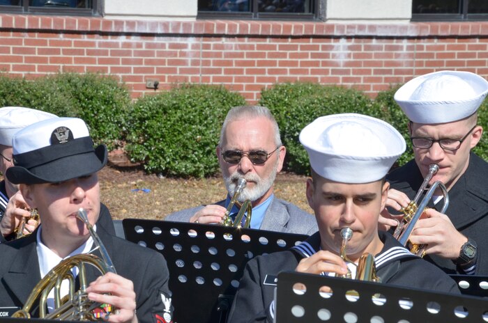Sailors play music during the graduation ceremony of Nuclear Power School class 1506 at Naval Nuclear Power Training Command (NNPTC) in Goose Creek, S.C. Based at Joint Base Charleston-Naval Weapons Station, NNPTC trains Sailors in fundamentals of design, operation, and maintenance of shipboard nuclear propulsion plants. (U.S. Navy Photo by Mass Communication Specialist Second Class Corey Dill)