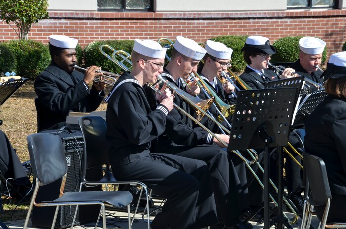 Sailors play music during the graduation ceremony of Nuclear Power School class 1506 at Naval Nuclear Power Training Command (NNPTC) in Goose Creek, S.C. Based at Joint Base Charleston-Naval Weapons Station, NNPTC trains Sailors in fundamentals of design, operation, and maintenance of shipboard nuclear propulsion plants. (U.S. Navy Photo by Mass Communication Specialist Second Class Corey Dill)