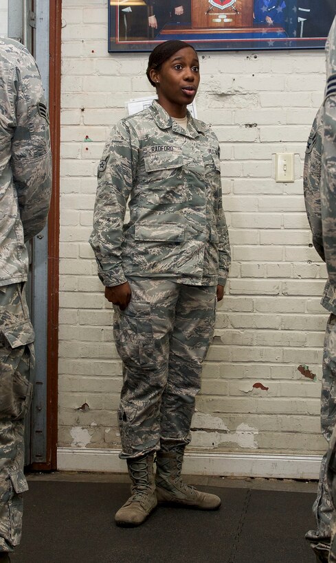 U.S. Air Force Airman 1st Class Rhanesha Radford, Langley Honor Guard head trainer, teaches trainees proper pivot movements  at Langley Air Force Base, Va., Feb. 16, 2016. The first day of ceremonial guardsman training consists of learning new movement and pivot patterns. (U.S. Air Force photo by Airman 1st Class Derek Seifert/Released) 