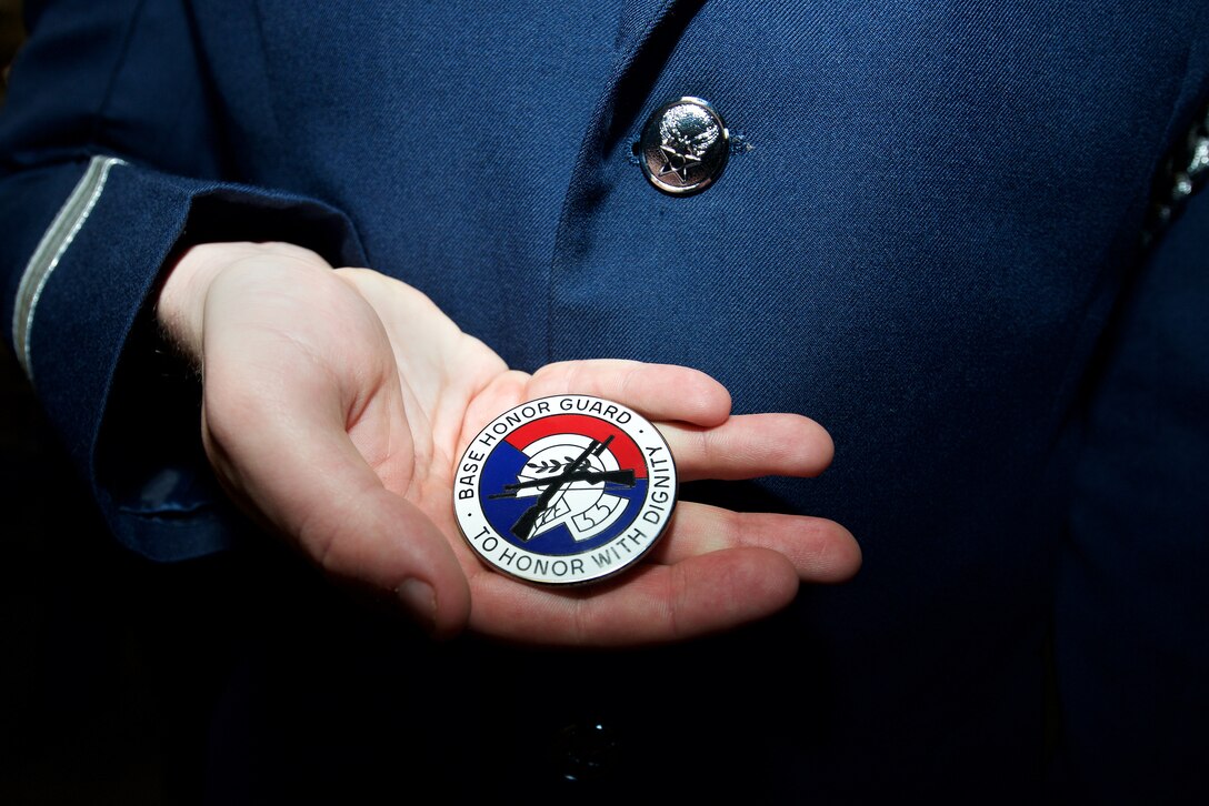 A U.S. Air Force Airman displays his Honor Guard badge at Langley Air Force Base, Va., Feb. 29, 2016. The Honor Guard badge symbolizes the end of the two week training and the beginning to a year of Honor Guard details for ceremonial guardsmen. (U.S. Air Force photo by Airman 1st Class Derek Seifert/Released)