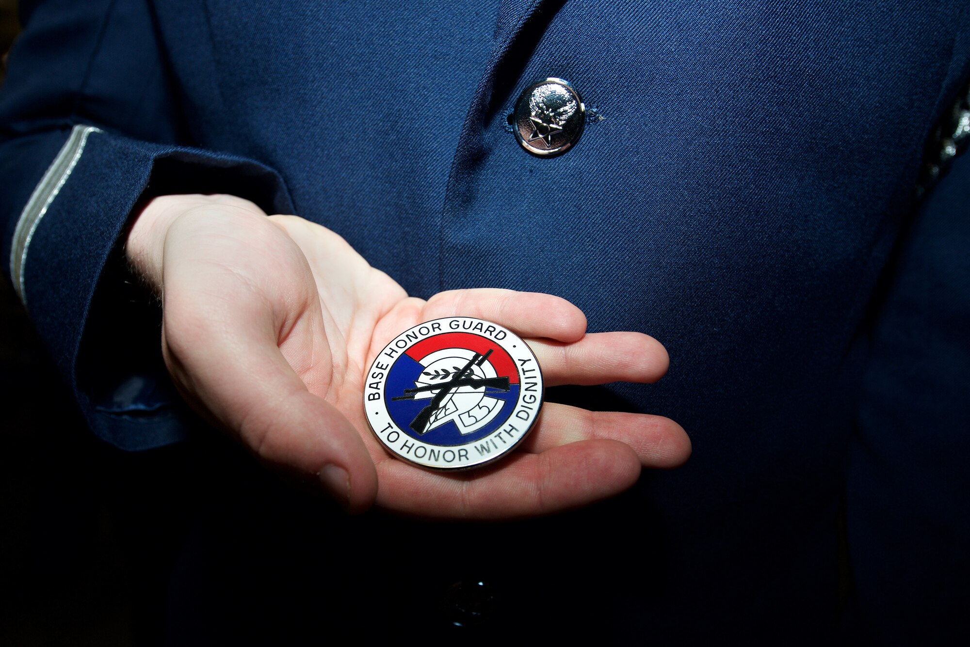 A U.S. Air Force Airman displays his Honor Guard badge at Langley Air Force Base, Va., Feb. 29, 2016. The Honor Guard badge symbolizes the end of the two week training and the beginning to a year of Honor Guard details for ceremonial guardsmen. (U.S. Air Force photo by Airman 1st Class Derek Seifert/Released)