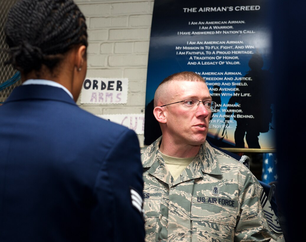 U.S. Air Force Chief Master Sgt. Ronald Beadles, 1st Fighter Wing command chief, talks with Honor Guard ceremonial guardsmen trainees at Langley Air Force Base, Va., Feb. 29, 2016. Beadles expressed his appreciation and pride for the Honor Guard before presenting each with the Honor Guard badge. (U.S. Air Force photo by Airman 1st Class Derek Seifert/Released)