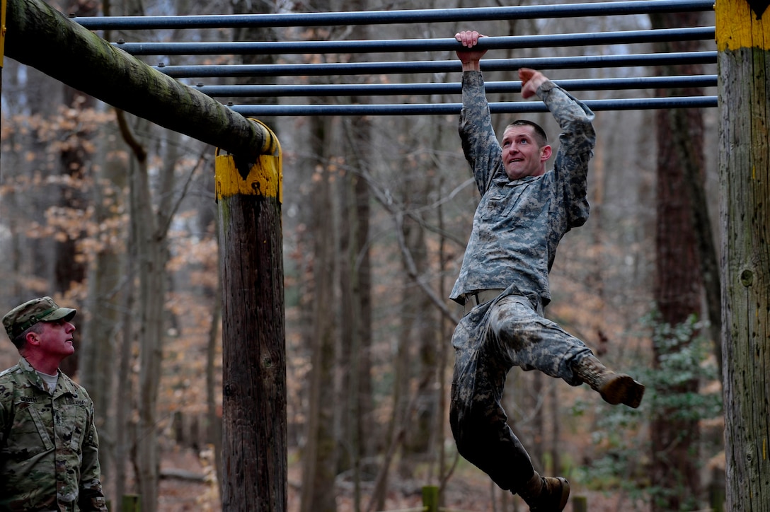 A U.S. Army Soldier completes an obstacle during the 128th Aviation Brigade Noncommissioned Officer of the Year and Platoon Sergeant of the Year Competition obstacle course at Fort Eustis, Va., Feb. 25, 2016. Supervisors and senior enlisted members participated in the obstacle course alongside the competitors. (Airman 1st Class Breonna Veal)