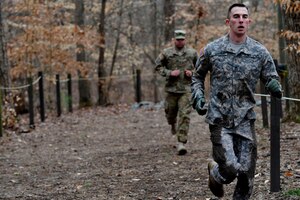 U.S. Army Soldiers run during the 128th Aviation Brigade Noncommissioned Officer of the Year and Platoon Sergeant of the Year Competition   obstacle course at Fort Eustis, Va., Feb. 25, 2016. The obstacle course consisted of 11 challenges that tested both physical and mental strength. (U.S. Air Force photo by Airman 1st Class Breonna Veal)