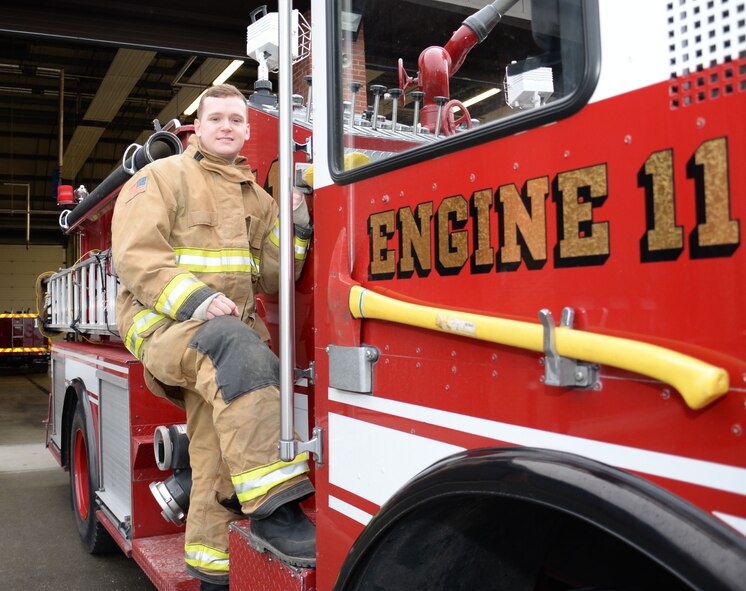 U.S. Air Force Senior Airman Conor Delaney, 100th Civil Engineer Squadron firefighter, poses for a photograph while checking his truck Feb. 22, 2016, on RAF Mildenhall, England. Delaney’s dream as a boy was to be a firefighter and serve his nation. (U.S. Air Force photo by Gina Randall/Released)