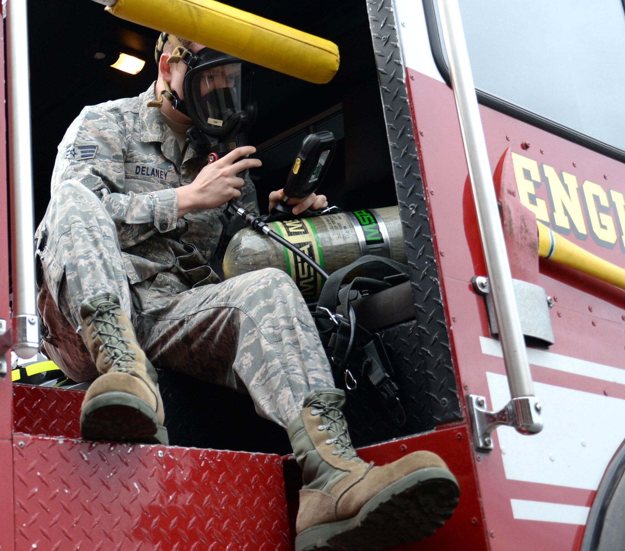 U.S. Air Force Senior Airman Conor Delaney, 100th Civil Engineer Squadron firefighter, checks his air tank Feb. 22, 2016, on RAF Mildenhall, England. After roll call each day, firefighters check out the trucks and tools they could potentially use throughout the day. (U.S. Air Force photo by Gina Randall/Released)