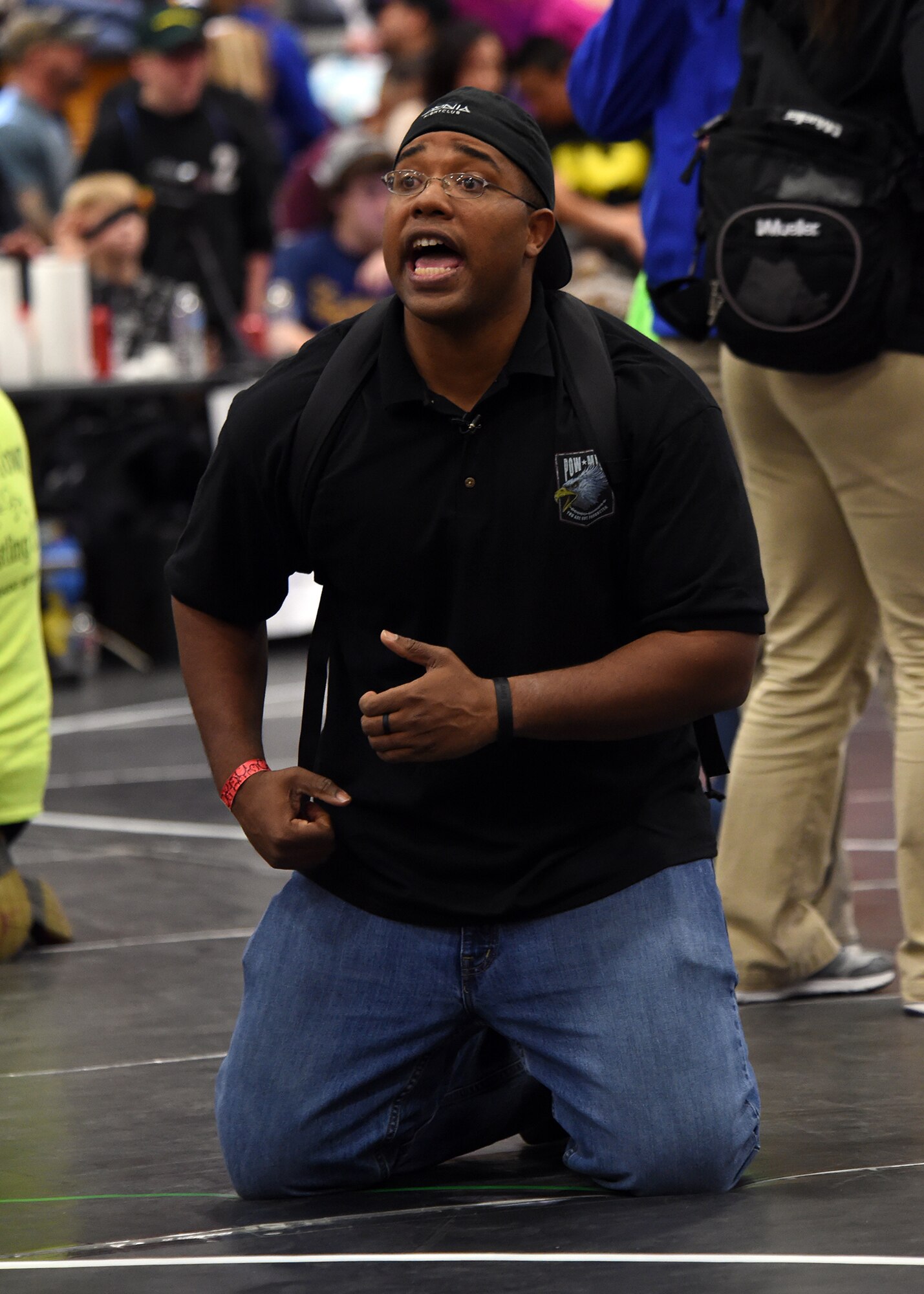 Morris Thomas, Children of Valor Wrestling Club coach, instructs a wrestler during the state championship wrestling tournament Sunday, Feb. 28, 2016, at the Douglas County Event Center in Castle Rock, Colorado. Thomas started the wrestling club 11 months ago at Schriever Air Force Base, Colorado, and took more than a dozen wrestlers to the state competition. (U.S. Air Force photo/Staff Sgt. Debbie Lockhart)