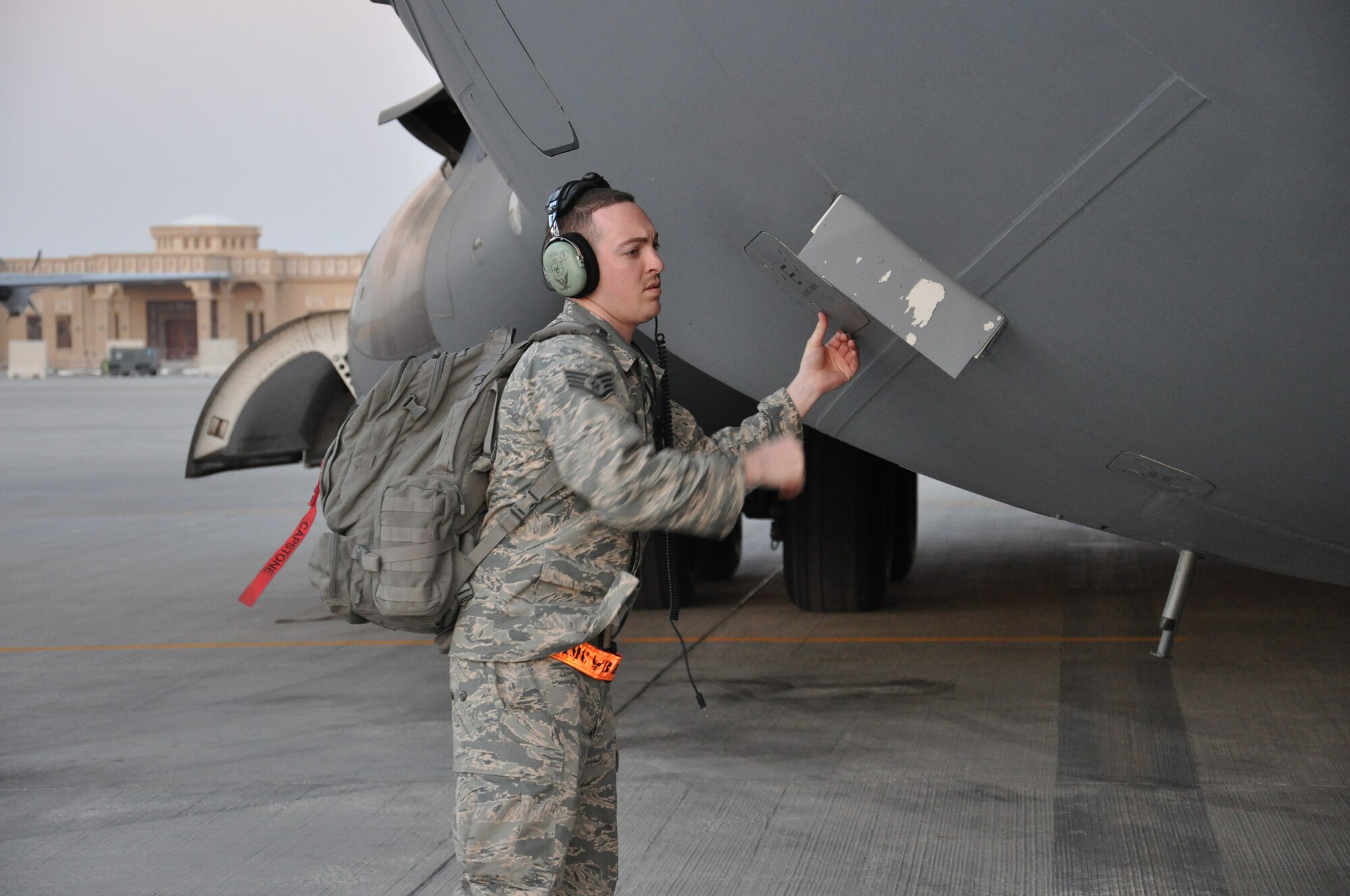Staff Sgt. Steven Sentner, 8th Expeditionary Air Mobility Squadron C-17 Globemaster III crew chief, from Irvine, Calif., inspects the landing gear of a C-17 at Al Udeid Air Base, Qatar, Feb. 19. The 8th EAMS maintenance team performs maintenance actions on C-17 aircraft to ensure they’re mission ready. (U.S. Air Force photo by Tech. Sgt. James Hodgman/Released)
