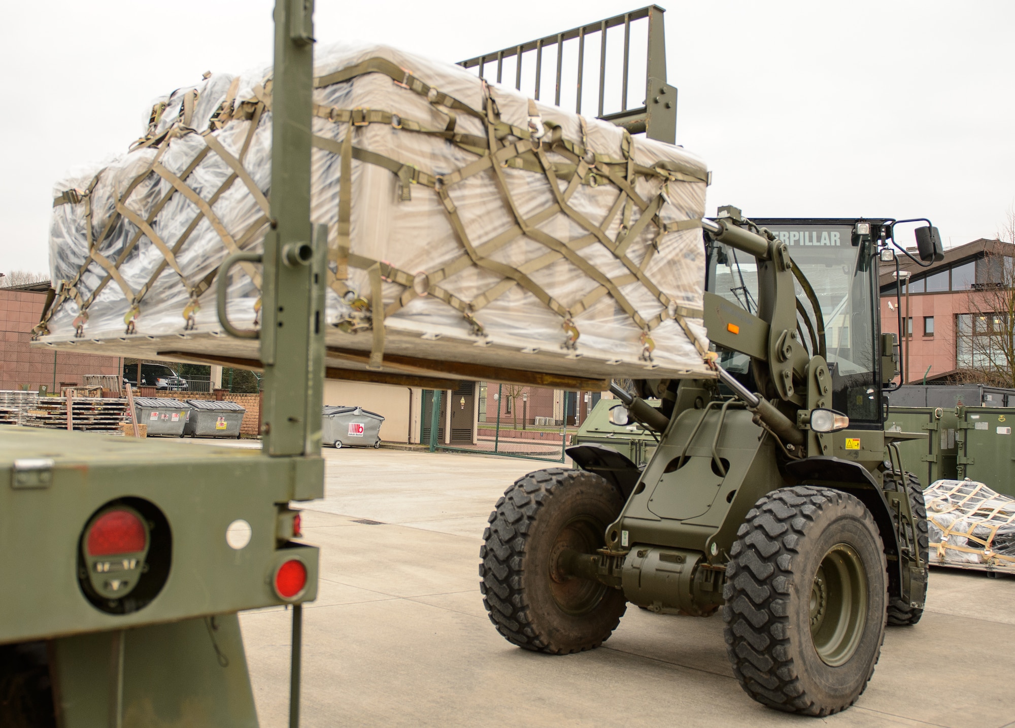 Tech. Sgt. Adam Stewart, 1st Combat Communications Squadron tactical network operation NCO in charge, loads equipment onto what Feb. 17, 2015, at Ramstein Air Base, Germany. Airmen from the 1st CBCS operate around Europe and Africa ensuring and providing support to a variety of operations and exercises. (U.S. Air Force photo/Staff Sgt. Armando A. Schwier-Morales)