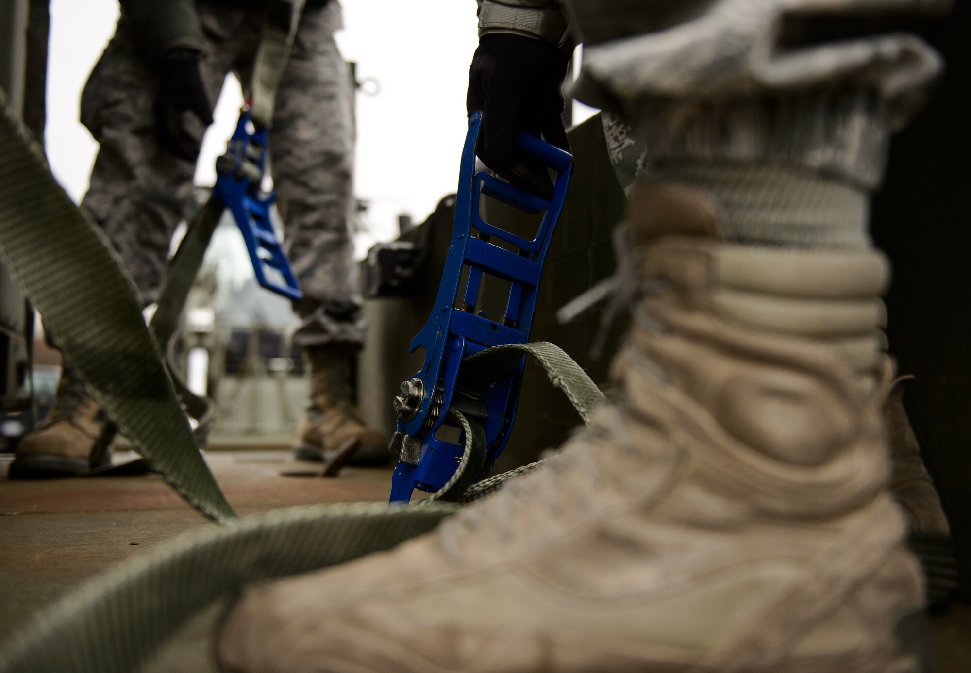 Airmen from the 1st Combat Communications Squadron strap down their equipment in preparation for a mission Feb. 17, 2015, at Ramstein Air Base, Germany. Airmen prepared their vehicles and equipment for transportation during a recent mission in support of exercises in Europe and Africa. (U.S. Air Force photo/Staff Sgt. Armando A. Schwier-Morales)