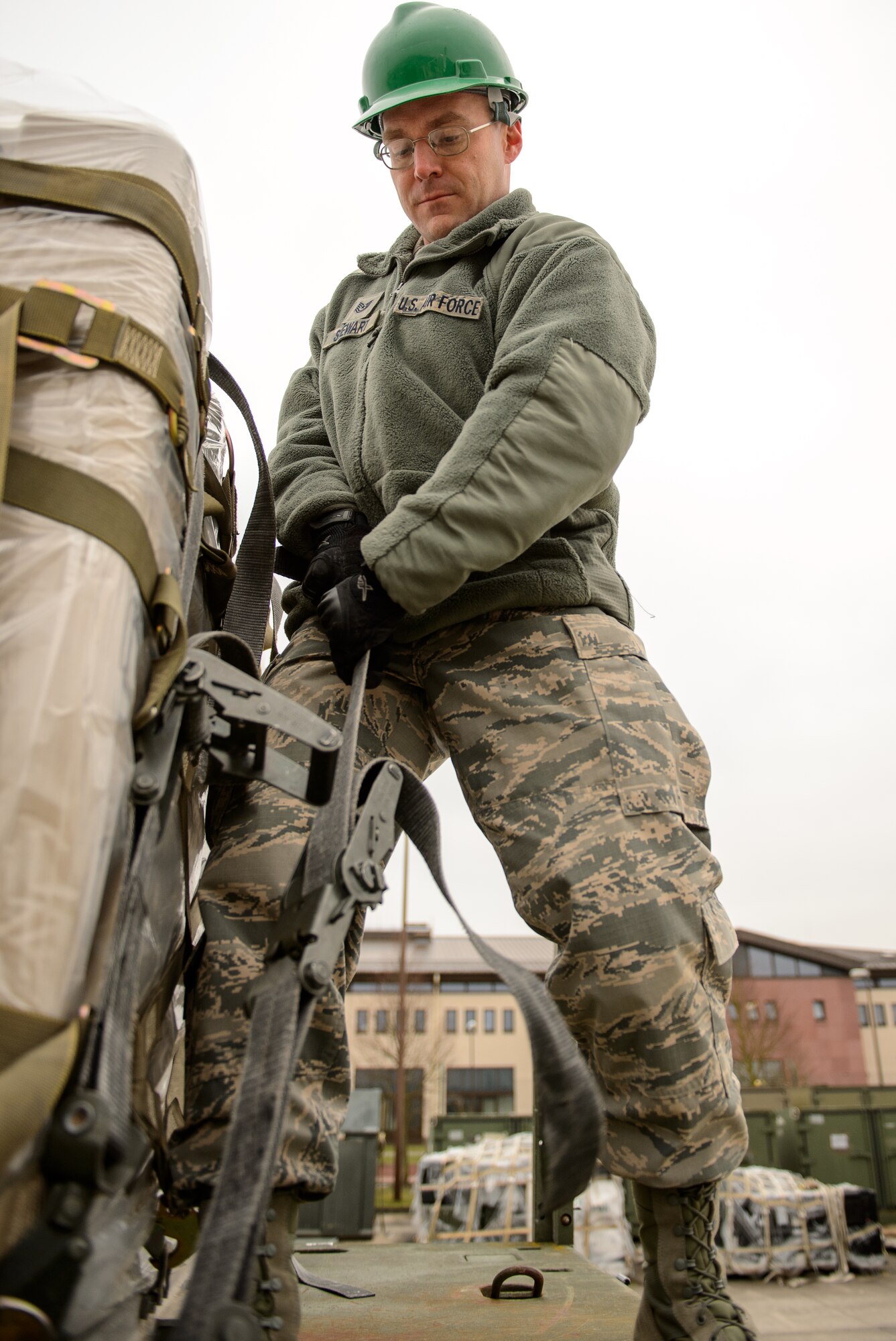 Tech. Sgt. Adam Stewart, 1st Combat Communications Squadron tactical network operation NCO in charge, secures a package Feb. 17, 2015, at Ramstein Air Base, Germany. Stewart and other 1st CBCS Airmen generated the first convoy from the 1st CBCS in years enabling them to travel with their equipment to a deployed location. (U.S. Air Force photo/Staff Sgt. Armando A. Schwier-Morales)