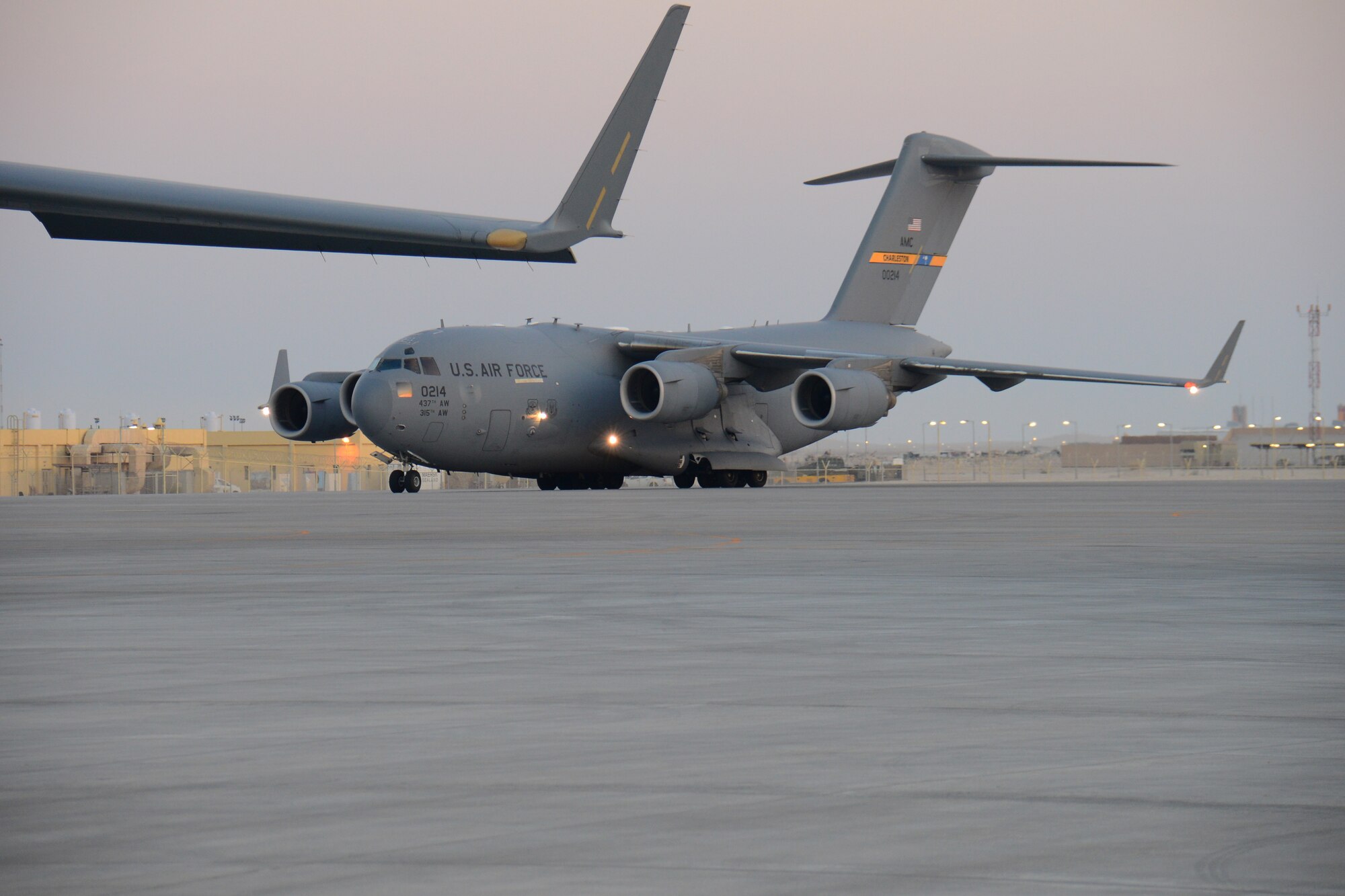 A C-17 Globemaster III from Joint Base Charleston, S.C., taxis to its parking spot at Al Udeid Air Base, Qatar, Feb. 19. The C-17 fleet at AUAB is maintained by the 8th Expeditionary Air Mobility Squadron maintenance team. The team performs maintenance actions on C-17 aircraft to ensure they’re mission ready. (U.S. Air Force photo by Tech. Sgt. James Hodgman/Released)