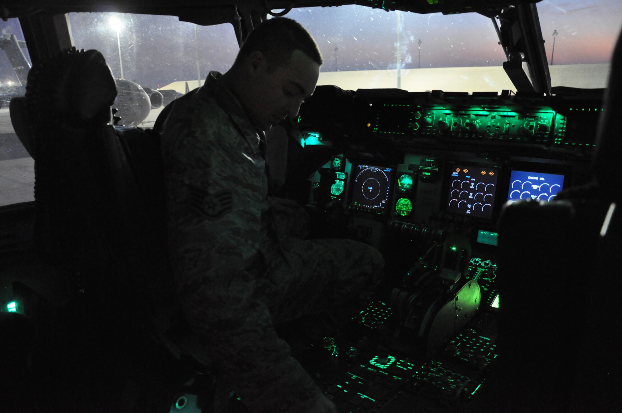 Staff Sgt. Steven Sentner, 8th Expeditionary Air Mobility Squadron C-17 Globemaster III crew chief, from Irvine, Calif., inspects avionics systems inside the cockpit of a C-17 at Al Udeid Air Base, Qatar, Feb. 19. The 8th EAMS maintenance team performs maintenance actions on C-17 aircraft to ensure they’re mission ready. (U.S. Air Force photo by Tech. Sgt. James Hodgman/Released)