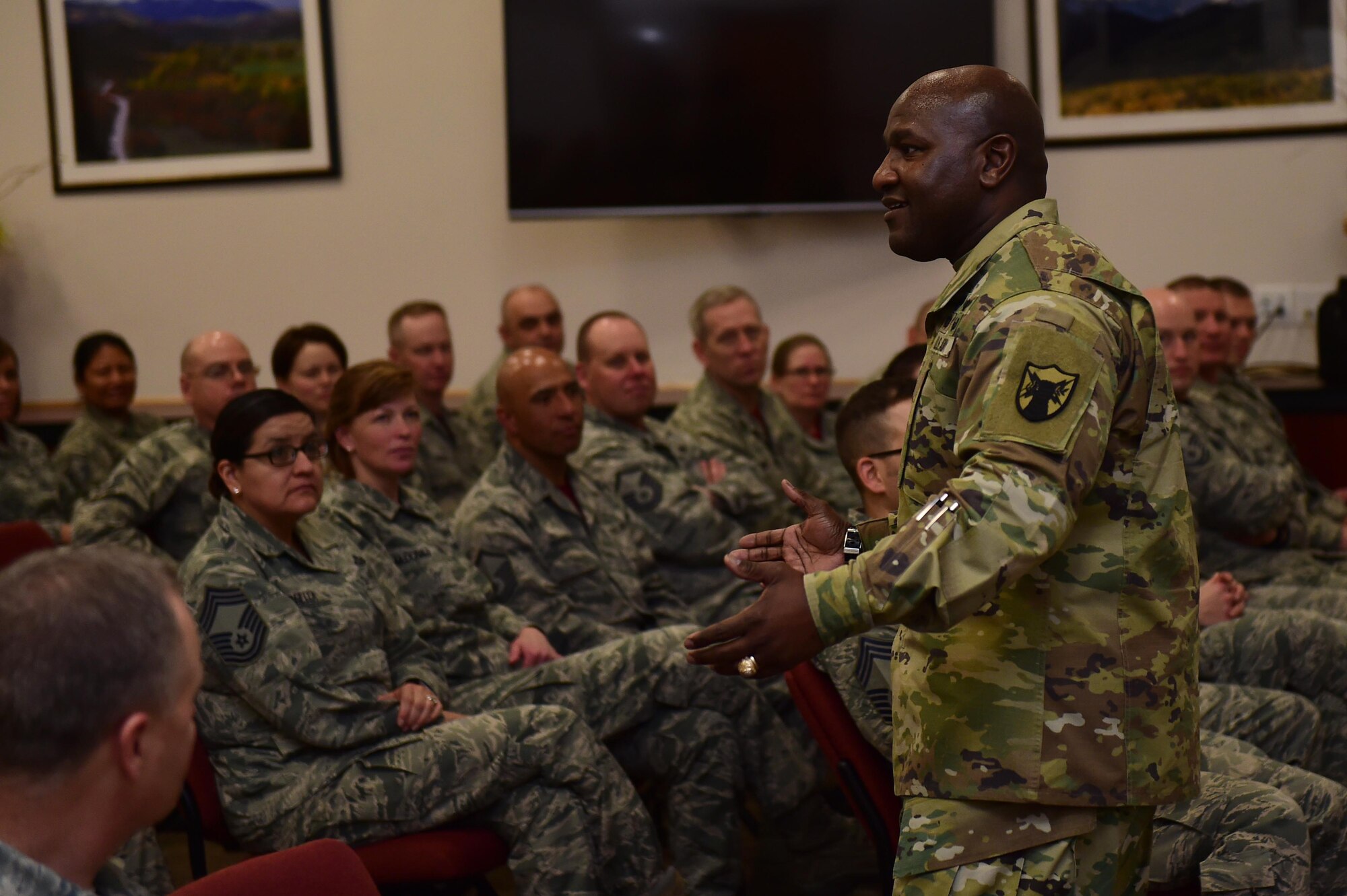 U.S. Army Command Sergeant Major Patrick Z. Alston, U.S. Strategic Command senior enlisted leader, speaks at a senior NCO call Feb. 26, 2016, on Buckley Air Force Base, Colo. Alston spoke with senior NCOs on how to connect with younger Airmen and mold them into more effective leaders. (U.S. Air Force photo by Airman 1st Class Gabrielle Spradling/Released)