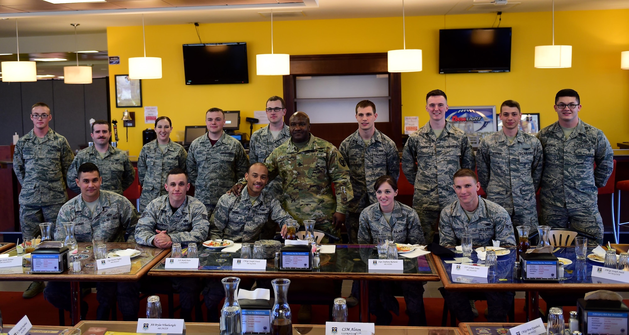 U.S. Army Command Sergeant Major Patrick Alston, U.S. Strategic Command senior enlisted leader, stands with Team Buckley Airmen Feb. 26, 2016, at the Panther Den on Buckley Air Force Base, Colo. Alston used the lunch hour to discuss leadership with Airmen from every rank tier. (U.S. Air Force photo by Airman 1st Class Gabrielle Spradling/Released)
