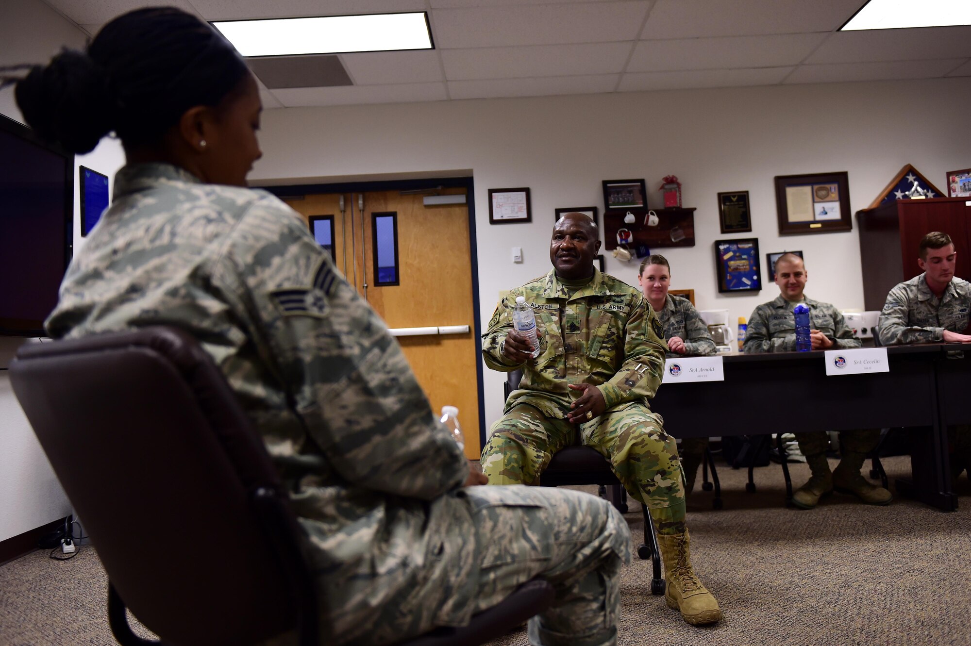 U.S. Army Command Sergeant Major Patrick Alston, U.S. Strategic Command senior enlisted leader, and U.S. Air Force Senior Airman Kelci Tolson, Airmen Leadership School student, discuss leadership roles Feb. 26, 2016, at the Airmen Leadership School on Buckley Air Force Base, Colo. Alston used different scenarios to teach Airmen about becoming more effective leaders. (U.S. Air Force photo by Airman 1st Class Gabrielle Spradling/Released)