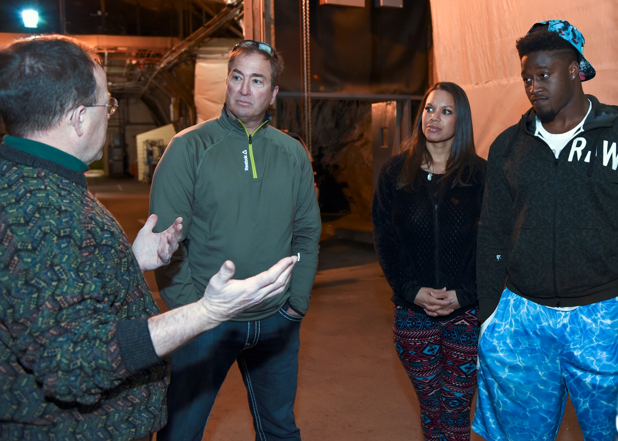 CHEYENNE MOUNTAIN AIR FORCE STATION - Steven Johnson, National Football League linebacker for the Tennessee Titans, his wife Stephanie, and Craig Domann, receive a tour from Steven Rose, 721st Mission Support Group deputy director, during a visit to Cheyenne Mountain Air Force Station on March 1, 2016. The visit and tour is part of the ongoing 50th Anniversary celebration for CMAFS. The installation was declared fully operational April 20, 1966. (U.S. Air Force photo by Tech. Sgt. Jared Marquis)