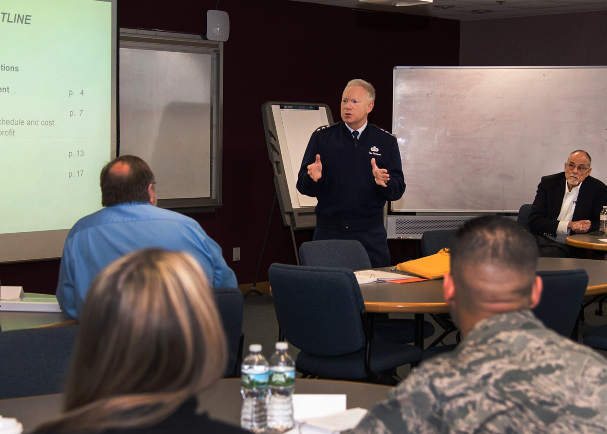 Lt. Gen. John Thompson, commander of the Air Force Life Cycle Management Center, talks with Hanscom program management students at the Base Education Center Feb. 29, as University of Massachusetts Lowell professor Steve Devaux looks on. In all, 30 Hanscom AFB employees will take six seminars on base this winter and spring then take the Project Management Professional (PMP) exam for certification. Massachusetts is sponsoring and primarily paying for the courses and exam as part of its Military Task Force's support to Hanscom. (U.S. Air Force photo by Walter Santos)