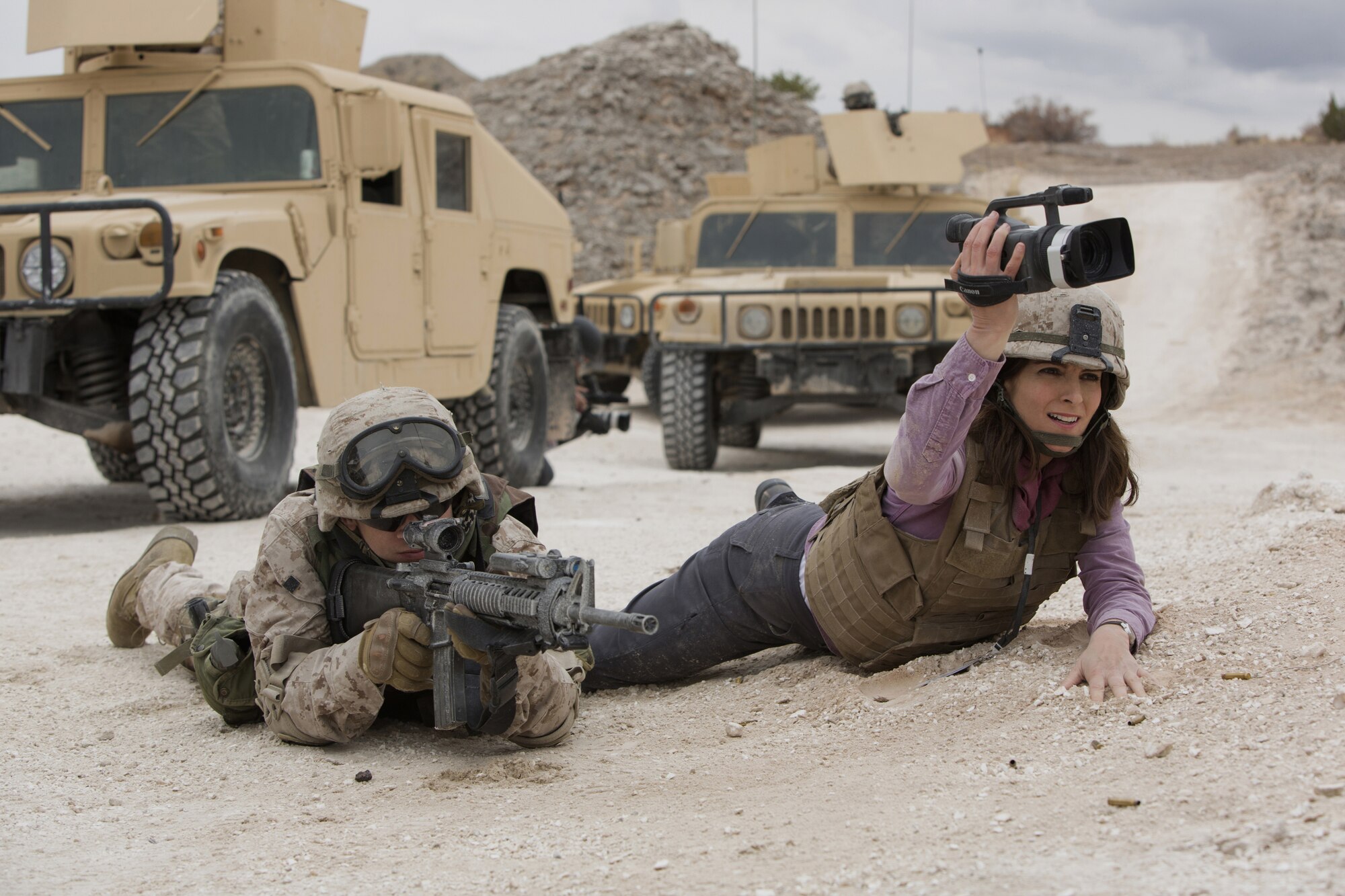 Scenes from the movie Whiskey Tango Foxtrot were shot at Kirtland in March 2015, and multiple military members, primarily from the 58th Special Operations Wing, were used as extras. Additionally, numerous airframes from Kirtland are integral to the movie. The scene here shows Evan Jonigkeit as an Army specialist and Tina Fey as journalist Kim Baker. (Courtesy photo)
