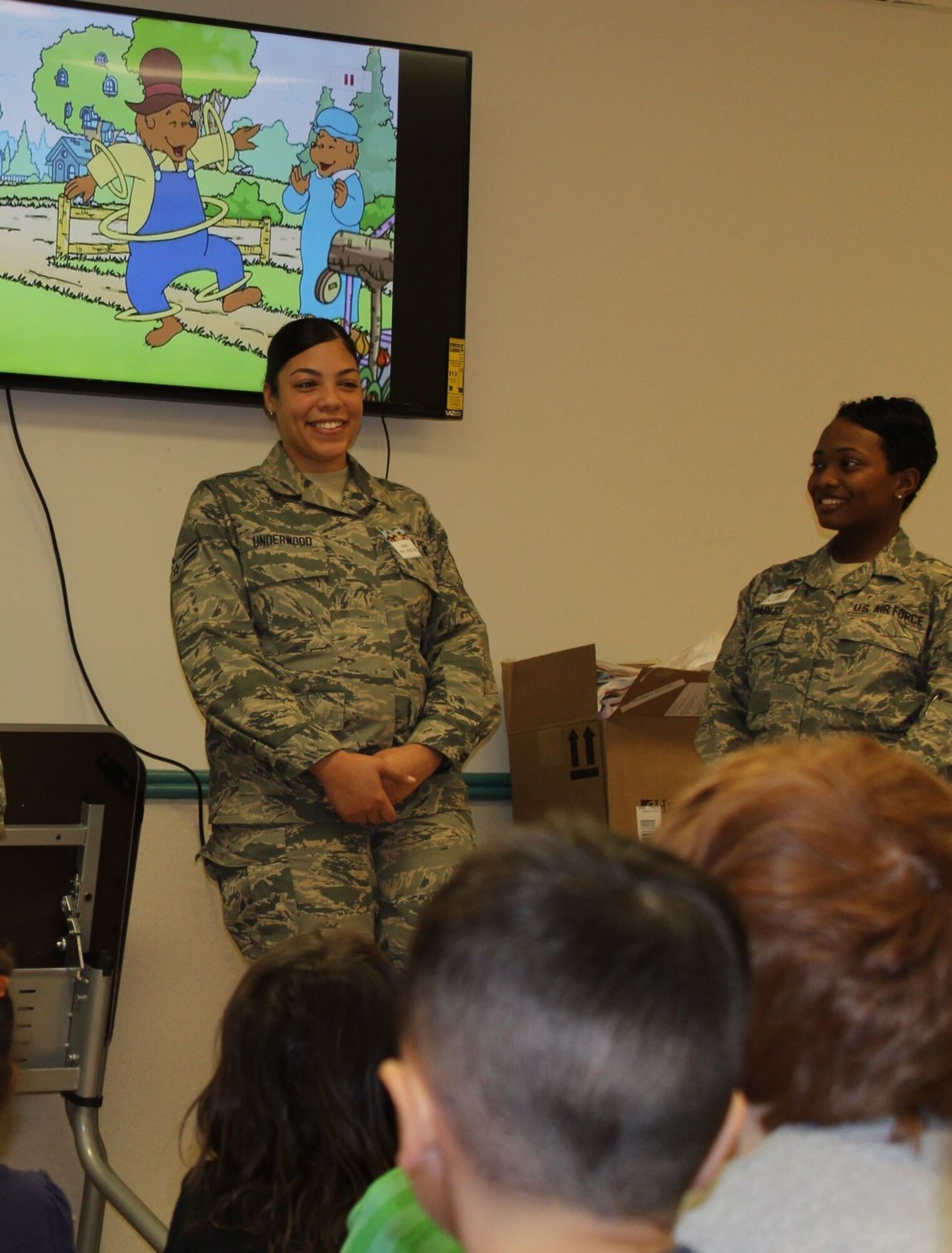 579th Dental Squadron's dental assistants Senior Airman Sade Underwood and Senior Airman Danielle Quarles talk to CDC 1 preschoolers about the importance of good oral habits, eating healthy snacks and visiting the dentist regularly. (U.S. Navy photo by Tamara Ward)