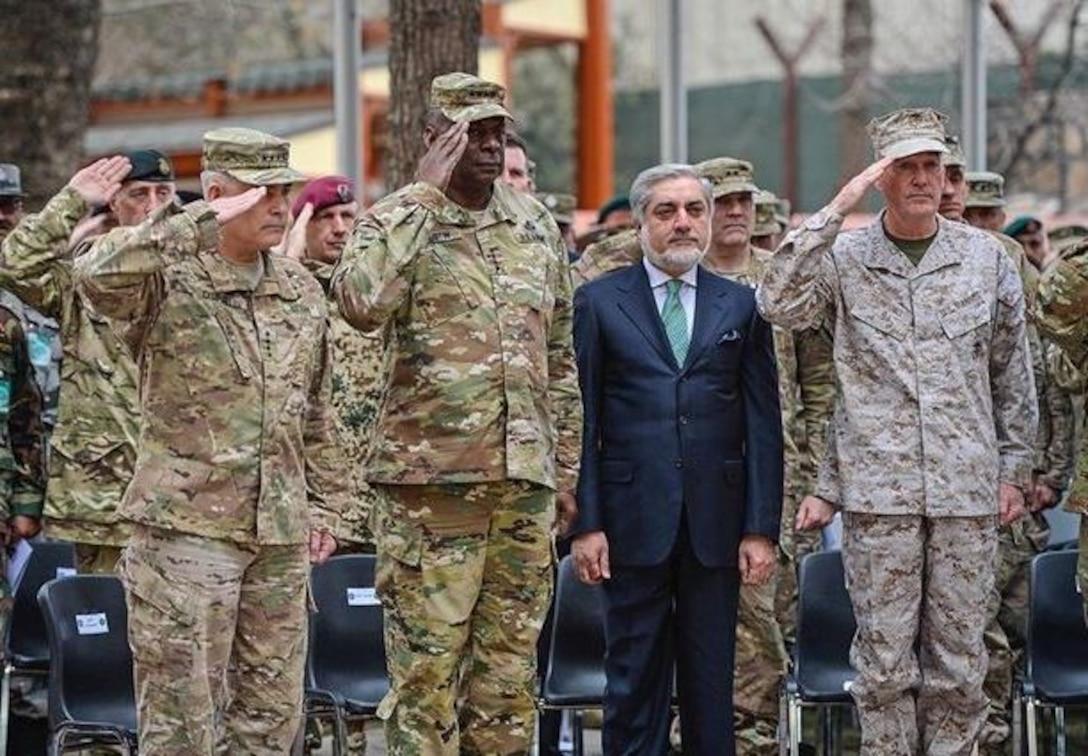 Marine Corps Gen. Joseph F. Dunford Jr., right, Army Gen. John F. Campbell, left, and Army Gen. Lloyd J. Austin III salute and stand with Afghan Chief Executive Officer Abdullah Abdullah during the change-of-command ceremony on Camp Resolute Support in Kabul, Afghanistan, March 2, 2016. (Air Force photo by Staff Sgt. Tony Coronado)