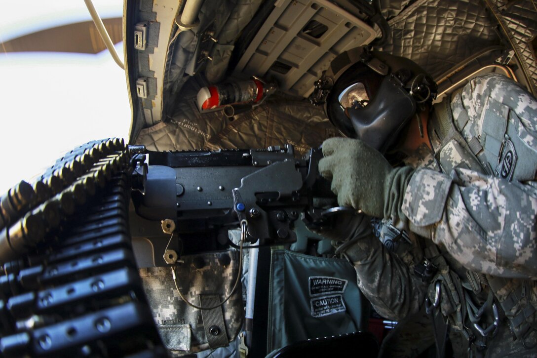 A soldier engages targets during an aerial gunnery exercise on Fort Pickett, Va., Feb. 28, 2016. The gunner is assigned to the 3rd General Support Aviation Battalion, 82nd Combat Aviation Brigade. Army photo by Staff Sgt. Christopher Freeman