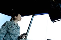 U.S. Air Force Tech. Sgt. Amber Weeks, 8th Operations Support Squadron tower watch supervisor, checks for incoming aircraft at Kunsan Air Base, Republic of Korea, Feb. 24, 2016. The Air Force entrusts these 19 Airmen with the responsibility of ensuring that aircraft are safe while taking off, landing and flying at Kunsan around the clock, 365 days of the year. (U.S. Air Force photo by Senior Airman Ashley L. Gardner/Released)