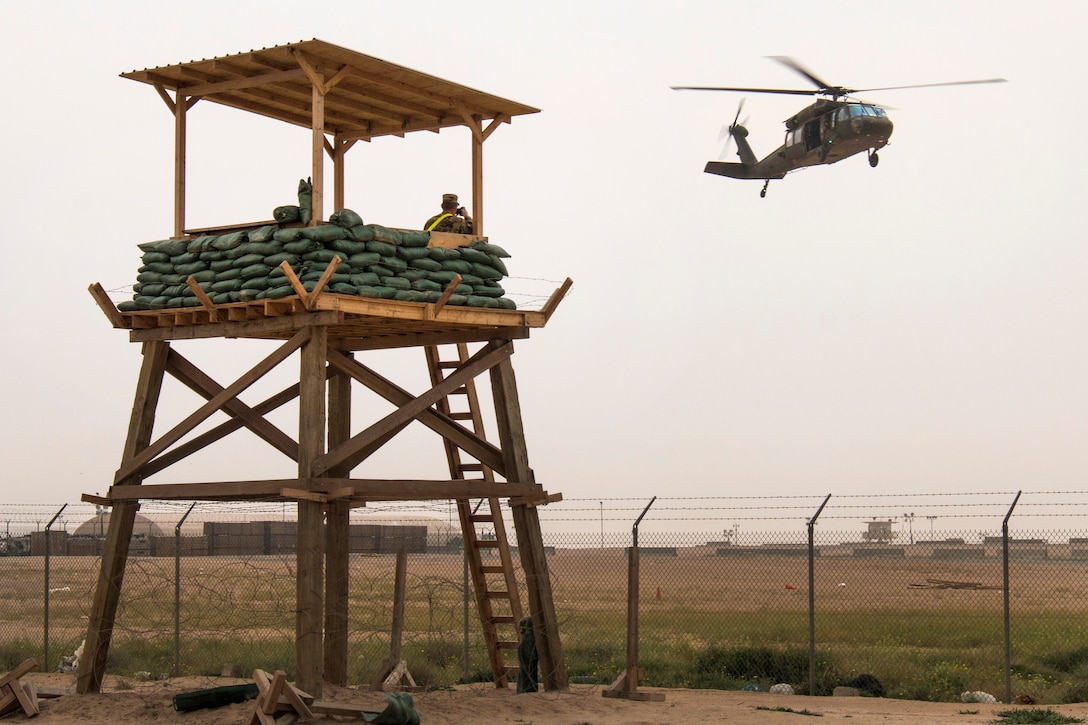 A UH-60 Black Hawk helicopter lands to evacuate a simulated patient from a tactical combat casualty care lane at Camp Buehring, Kuwait, Feb. 23, 2016. The helicopter crew is assigned to the California Army National Guard’s Company F, 2nd Battalion, 238th Aviation Regiment, 40th Combat Aviation Brigade. Army photo by Staff Sgt. Ian M. Kummer