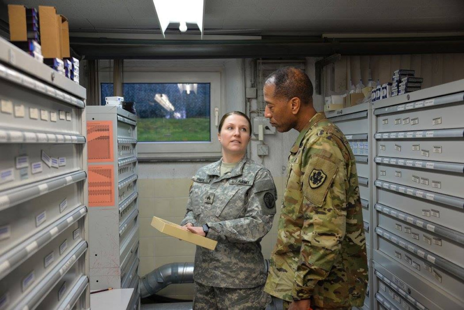 SGT Ashley Irmak, with the U.S. Army Medical Material Center, Europe in Pirmasens, Germany, provided Army Brig. Gen. Charles Hamilton, DLA Troop Support commander, a brief on the Optical Activities Division. Hamilton went to USAMMCE as part of his first visit to DLA Troop Support Europe and Africa. 