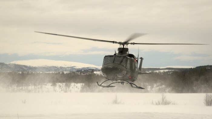 Norwegian Minister of Defense Ine Marie Eriksen Søreide leaves shortly after talking with the U.S. Marines of Task Force 1/8 at a training area near Steinkjer, Norway during Exercise Cold Response March 2, 2016. Cold Response is a multi-national exercise combining the efforts of 12 NATO allies and partner nations and approximately 15,000 troops taking place across Norway.