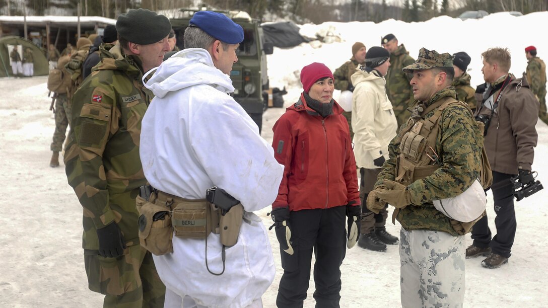 Norwegian Minister of Defense Ine Marie Eriksen Søreide talks with Lt. Col. Justin Ansel, the commanding officer of Task Force 1/8, and officers from Norway and Sweden at a training location near Steinkjer, Norway, March 2, 2016. Exercise Cold Response 16 is a multinational exercise combining the efforts of 13 NATO allies and partner nations and approximately 15,000 troops taking place across Norway.