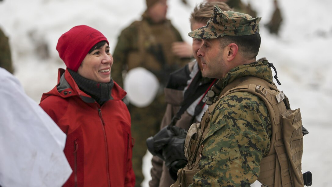 Norwegian Minister of Defense Ine Marie Eriksen Søreide  talks with Lt. Col. Justin Ansel, the commander of Task Force 1/8, at a training location near Steinkjer, Norway, March 2, 2016. Exercise Cold Response 16 is a multi-national exercise combining the efforts of 12 NATO allies and partner nations and approximately 15,000 troops taking place across Norway.