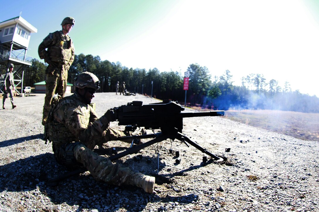 Army Capt. Kamara, foreground, fires a MK19 grenade launcher during a gunnery exercise on Fort Pickett, Va., Feb. 28, 2016. Kamara is commander, 82nd Airborne Division’s Headquarters Company, 3rd General Support Battalion, 82nd Combat Aviation Brigade. Army photo by Staff Sgt. Christopher Freeman