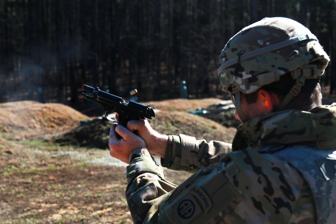 A soldier fires his 9 mm pistol at targets on a qualification range on Fort Pickett, Va., Feb. 28, 2016. The soldier is assigned to the 82nd Airborne Division’s 3rd General Support Aviation Battalion, 82nd Combat Aviation Brigade. Army photo by Staff Sgt. Christopher Freeman