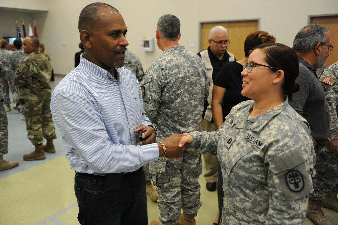 Sgt. Melvin Vega thanks Capt. Yomaris Rivera, commander for CCU-PR for her support during his time in the program after the Community Care Unit inactivation ceremony on Fort Buchanan, PR, March 1. Vega (Photo by US Army Spc. Anthony Martinez)