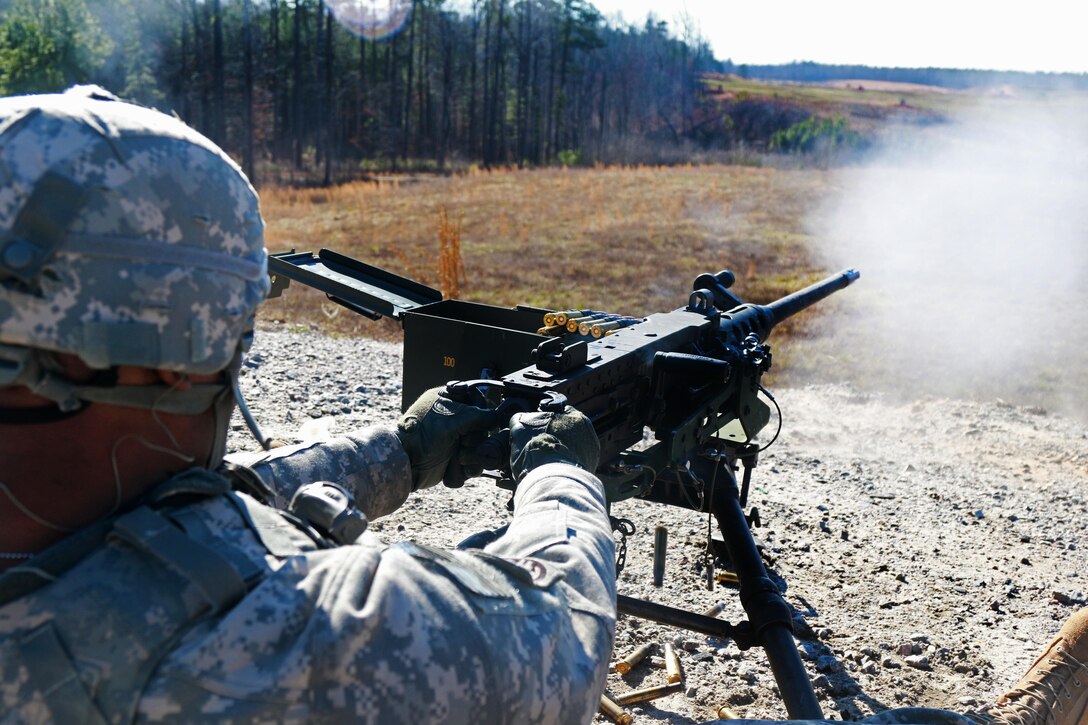 Army Master Sgt. Baldwin fires a .50-caliber machine gun at a qualification range on Fort Pickett, Va., Feb. 28, 2016. Baldwin is an operations noncommissioned officer assigned to the 82nd Airborne Division’s 3rd General Support Aviation Battalion, 82nd Combat Aviation Brigade. Army photo by Staff Sgt. Christopher Freeman