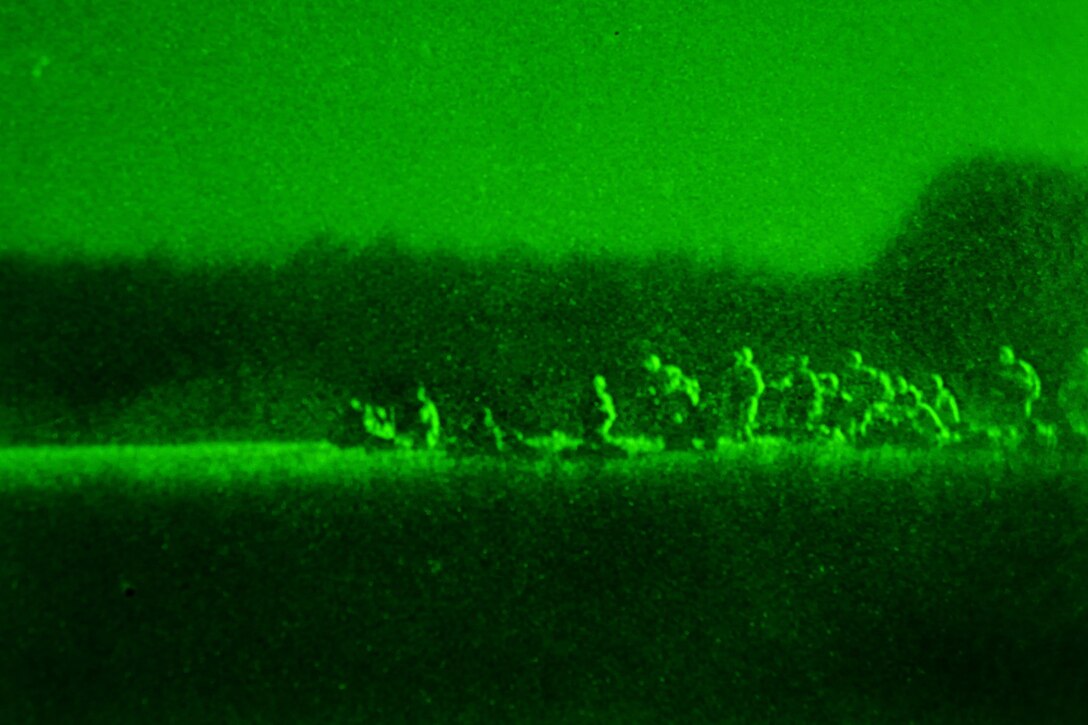 As seen through a night-vision device, paratroopers offload from a CH-47 Chinook helicopter during an air assault excise on Fort Pickett, Va., Feb. 29, 2016. Army photo by Staff Sgt. Christopher Freeman