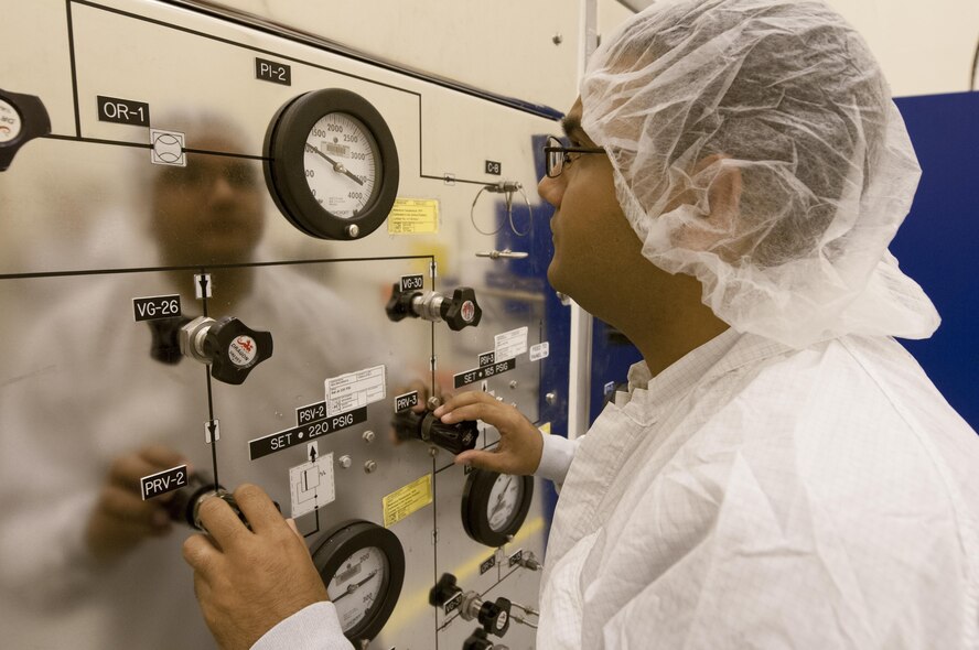 Staff Sgt. David Jeetan, a mission assurance technician with the 45th Launch Support Squadron, inspects the nitrogen and helium panel inside a satellite processing facility at Cape Canaveral Air Force Station, Fla., Feb. 24, 2016. The gases are typically used to clean ground support equipment. (U.S. Air Force photo/Sean Kimmons)