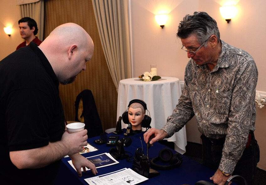 David Hurst, sales representative, speaks with a patron of the 4th annual technology expo at Barksdale Air Force Base, La., Feb. 25, 2016. Hurst’s organization is a leading manufacturer of wired and wireless headsets for communicating within secure or commercial environments. (U.S. Air Force photo/Airman 1st Class Curt Beach)