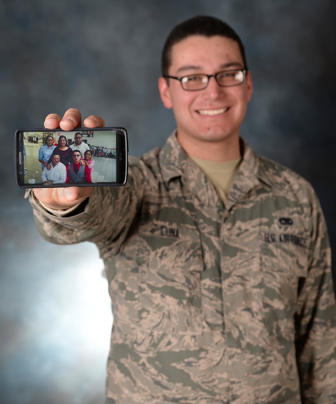 Airman 1st Class Ignacio Luna Jr., 28th Aircraft Maintenance Squadron, proudly displays a photo of his family at Ellsworth Air Force Base, S.D., Feb. 10, 2016. Luna uses his family to motivate him to work hard and be the best Airman he can be. U.S. Air Force photo by Airman Sadie Colbert