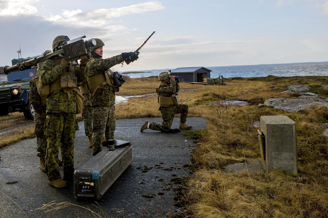 A U.S. Marine points in the direction that a fellow Marine will fire a FIM-92C Stinger missile as a part of Exercise Cold Response 16 at Orland, Norway, Feb. 24, 2016. Marine Corps photo by Cpl. Rebecca Floto
